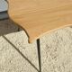 Violin-shaped coffee table with brass legs