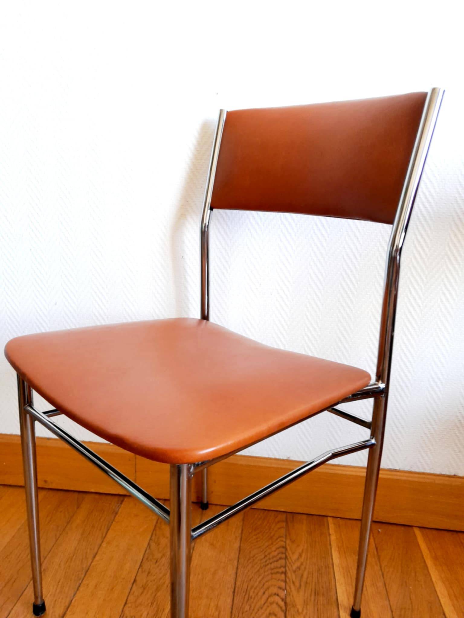 Three mid-century chairs in faux leather and chrome from the 1950s.