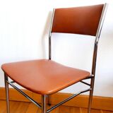 Three mid-century chairs in faux leather and chrome from the 1950s.