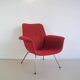 Red armchair with metal legs