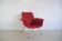Red armchair with metal legs