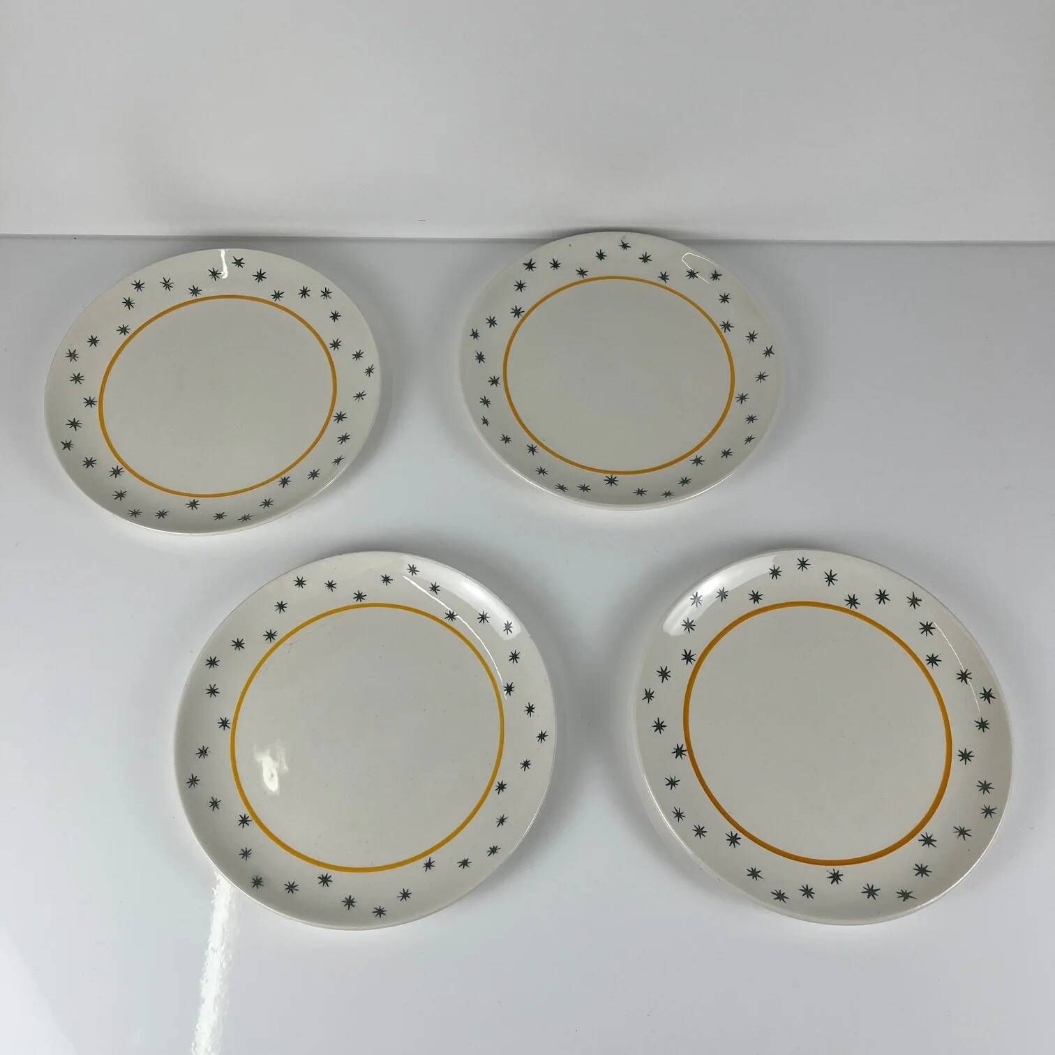 Set of 4 dessert plates GIEN, Primefleur creation, model "Constellation", 1950.