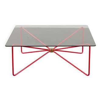 Italian mid century modern coffee table with red "spaghetti " base and thick glass top, 1970s