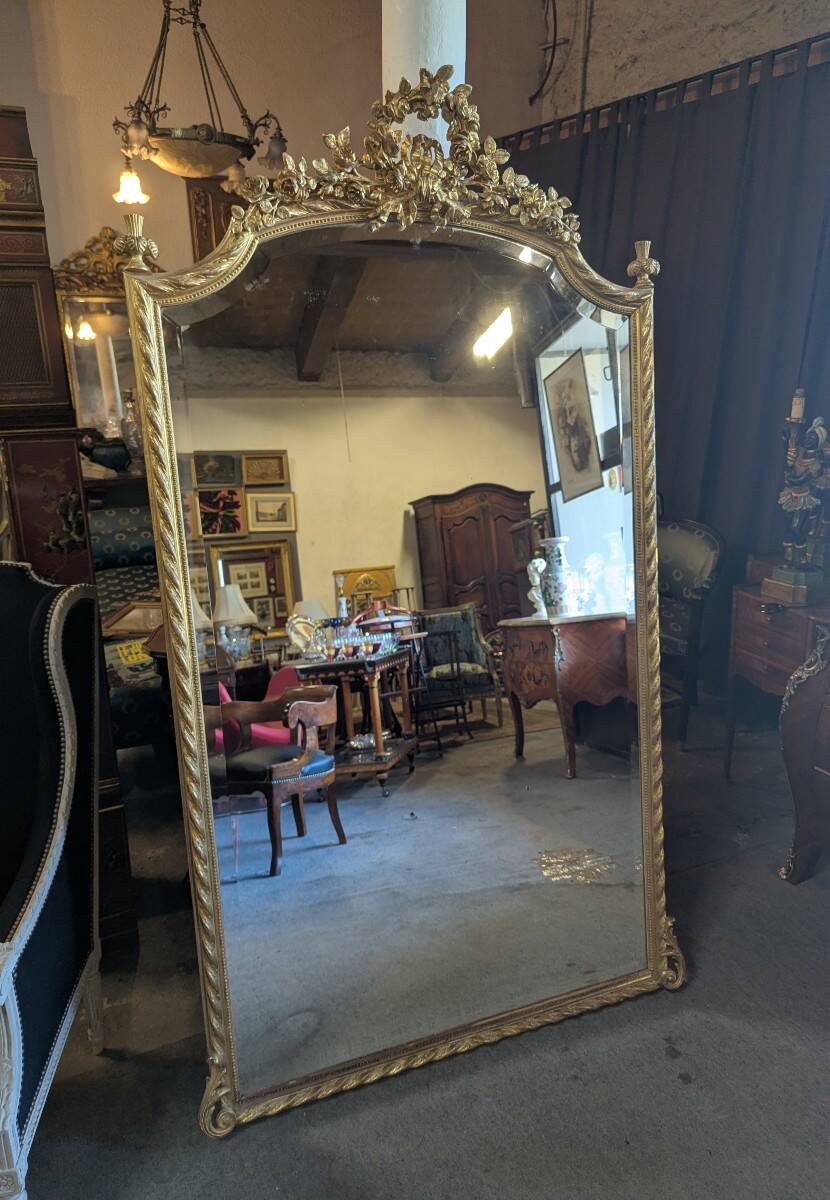 Very large Louis XVI style mirror in wood and gilded stucco with gold leaf
