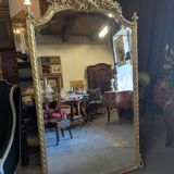 Very large Louis XVI style mirror in wood and gilded stucco with gold leaf