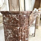 Red marble fireplace in the Louis XVI style, late 19th century