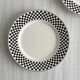 Pair of vintage plates with a black and white checkered pattern.