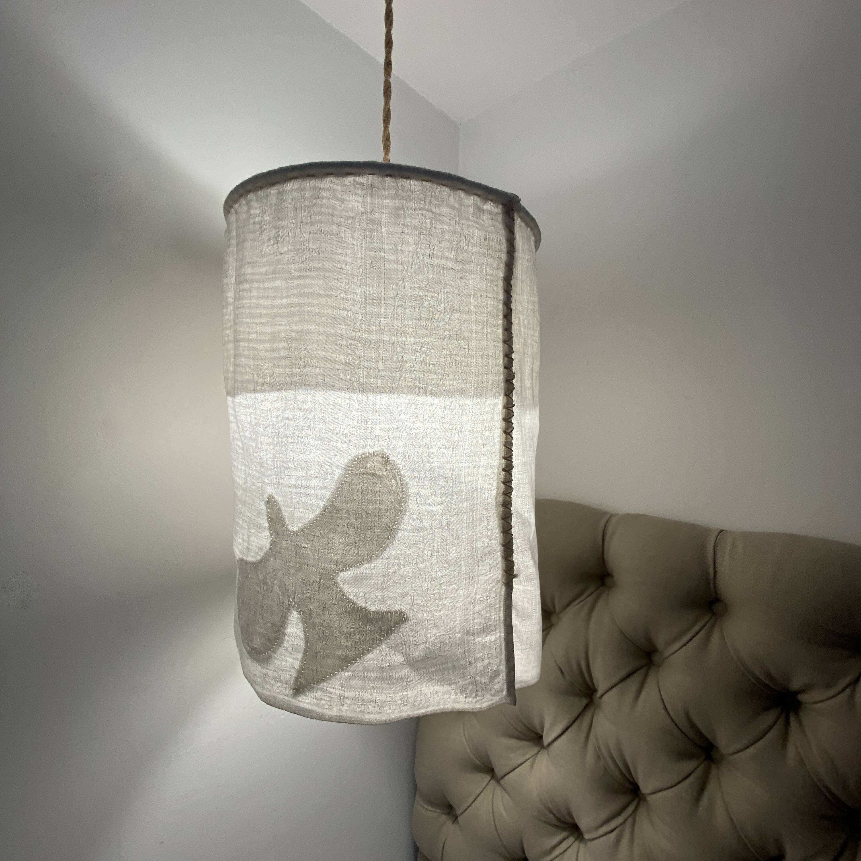 Old linen drapery with monogram and bird by Georges Braque