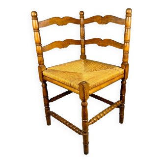 Fauteuil d'angle vintage en bois et assise en paille tressée