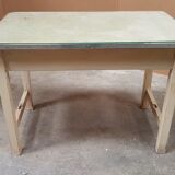 Old desk table with glass plate and drawer