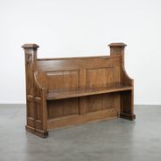 Antique oak church bench in Gothic style with beautiful wood carving