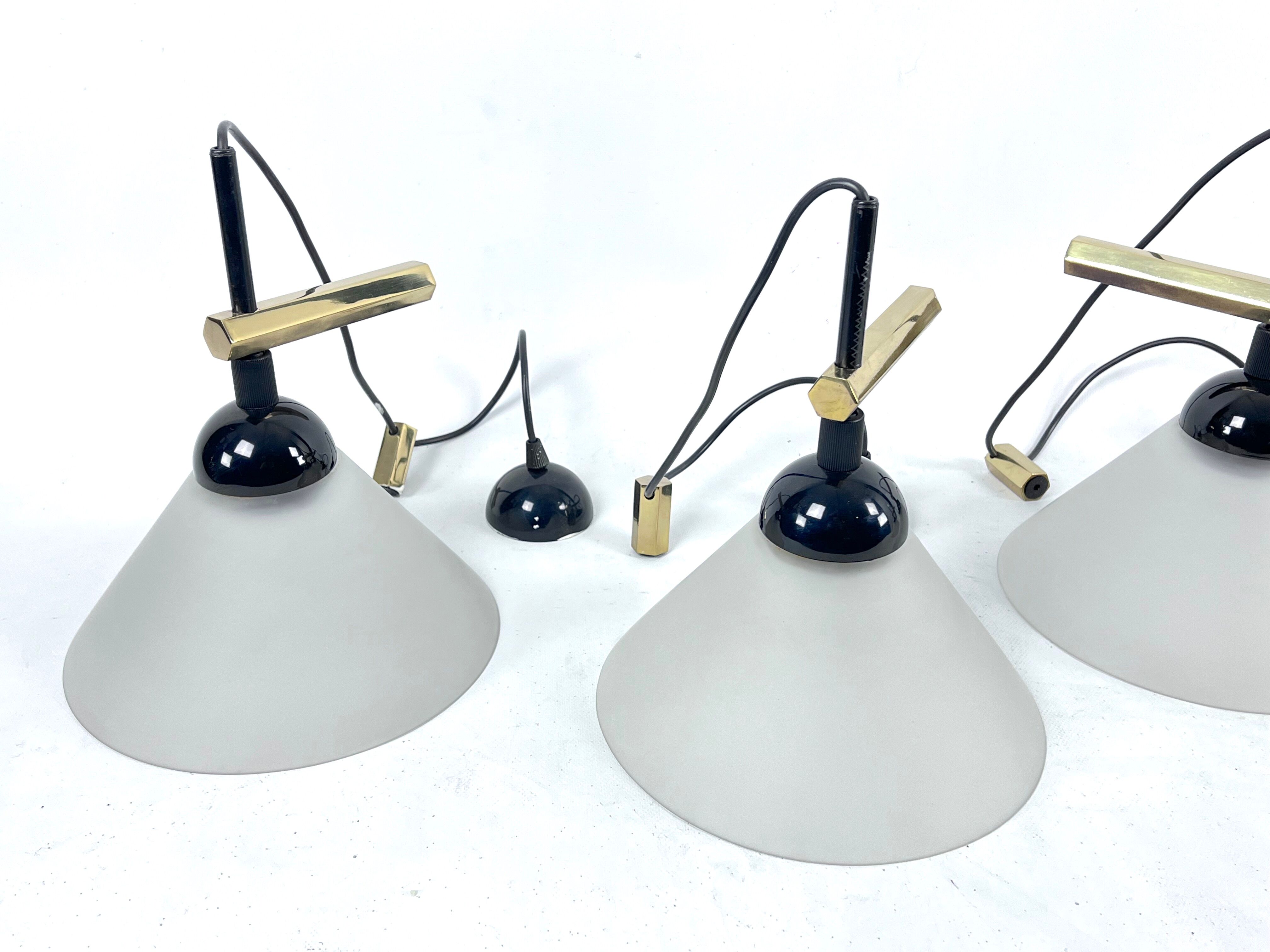 Rare Set of four Italian Modern brass and Murano glass wall lamps by Quattrifolio. 1970s