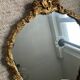 Miroir ancien en bois doré