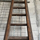 Very large vintage sliding wooden ladder