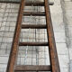 Very large vintage sliding wooden ladder