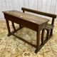 Early 20th-century oak school desk with porcelain inkwells