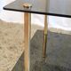 Coffee table in gilded metal and smoked glass – 60s