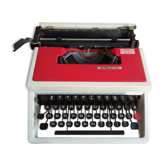 Typewriter "Burelec 315" made in Spain in red and white metal.