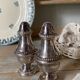 Silver-plated salt and pepper shakers, fluted, beaded decoration.