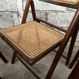 Serie de 8 chaises pliantes vintage en bois et cannage 1960