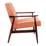 Mid-century modern armchair in coral red designed by H. Lis.