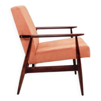 Mid-century modern armchair in coral red designed by H. Lis.