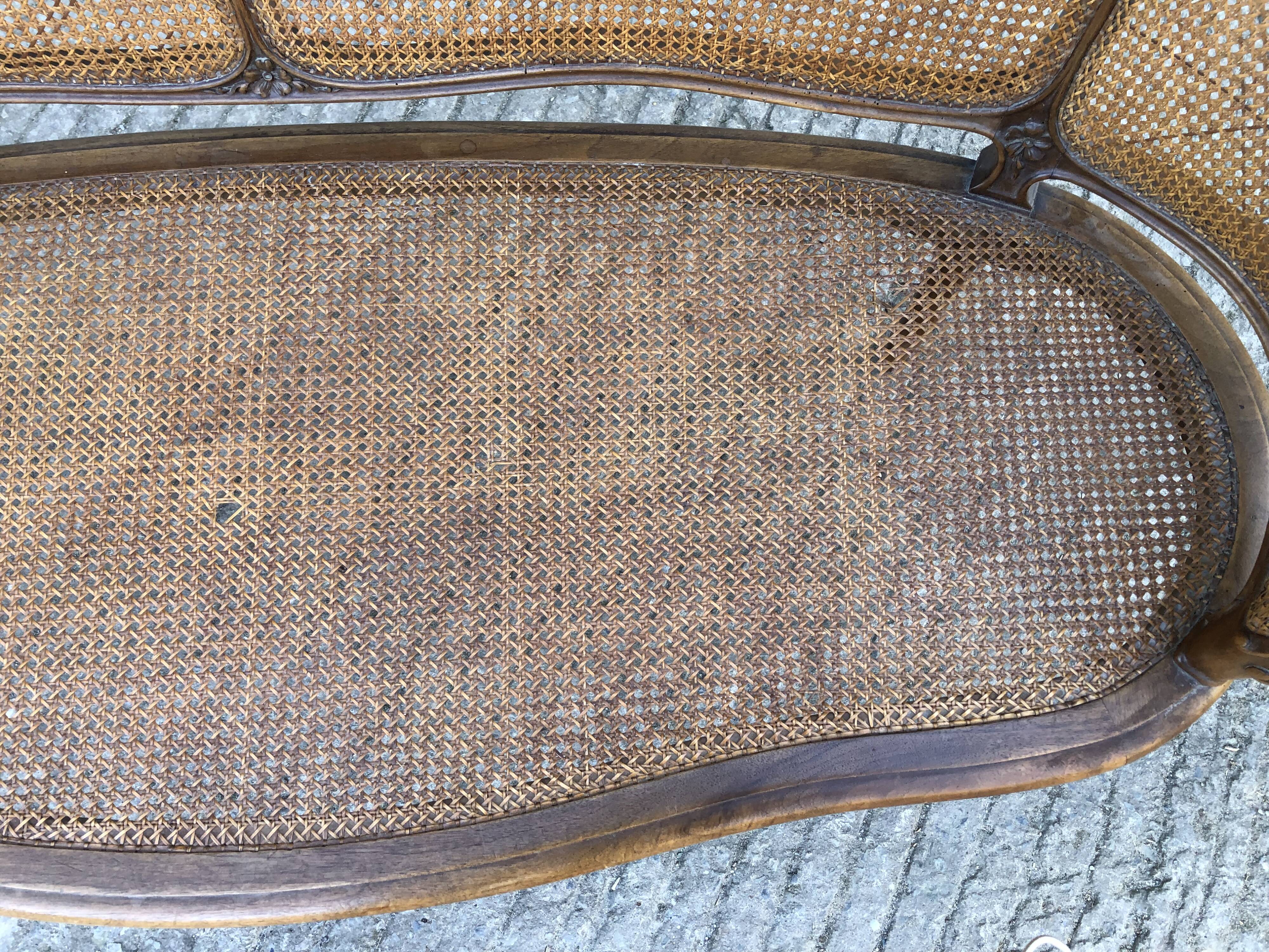 Antique Louis XV bench in solid walnut and caning