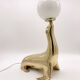Vintage brass sea lion lamp