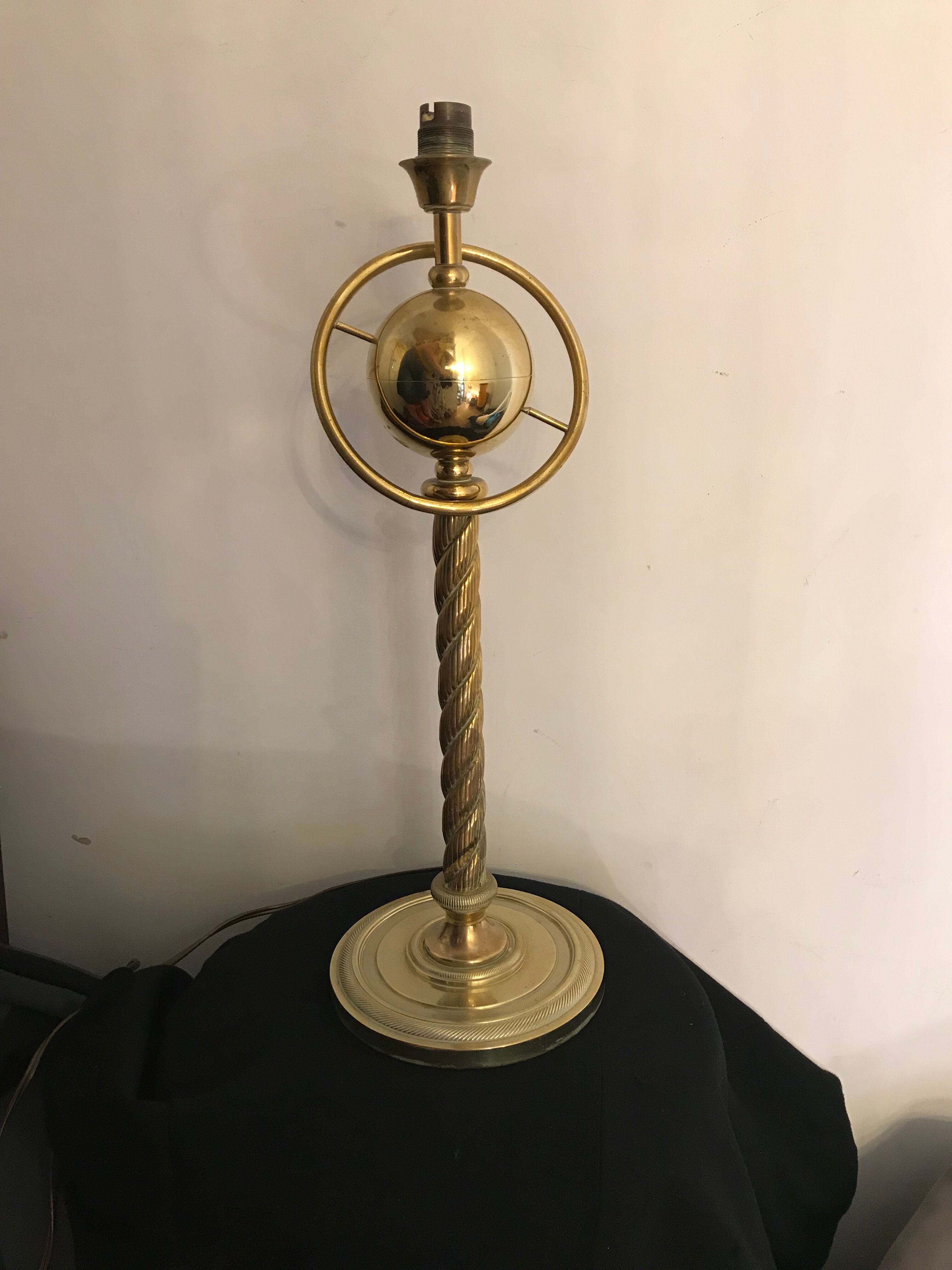 Brass lamp with removable ring around a globe