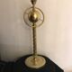 Brass lamp with removable ring around a globe
