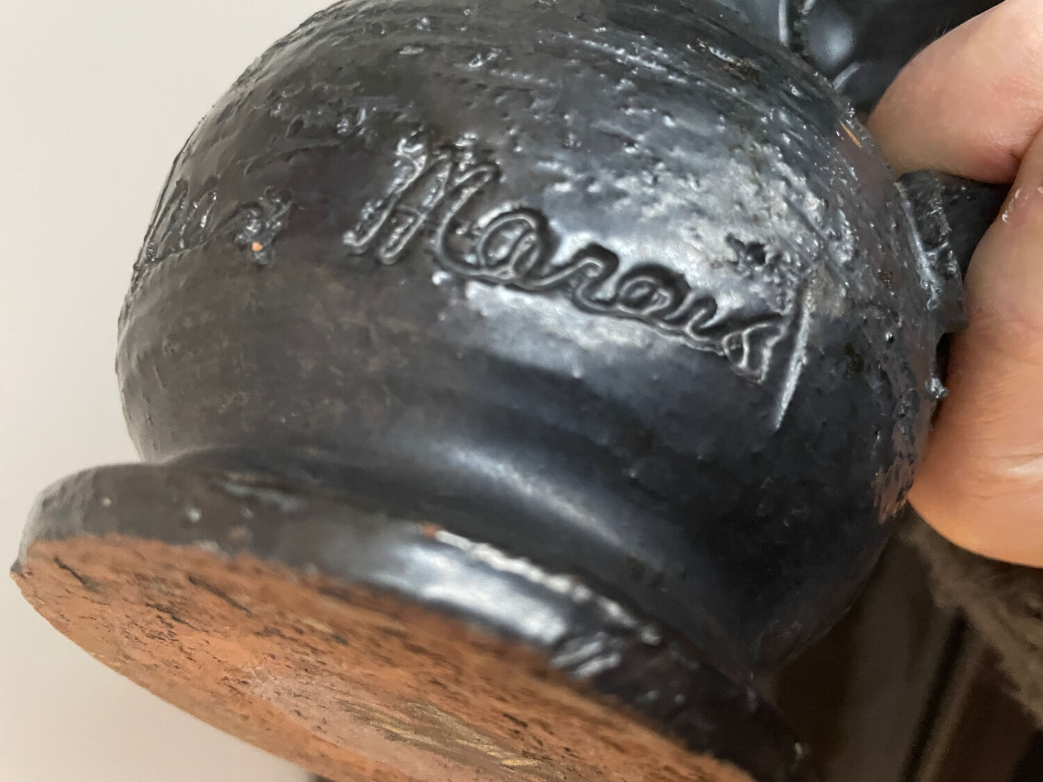 Black ceramic pitcher by Jean Marais