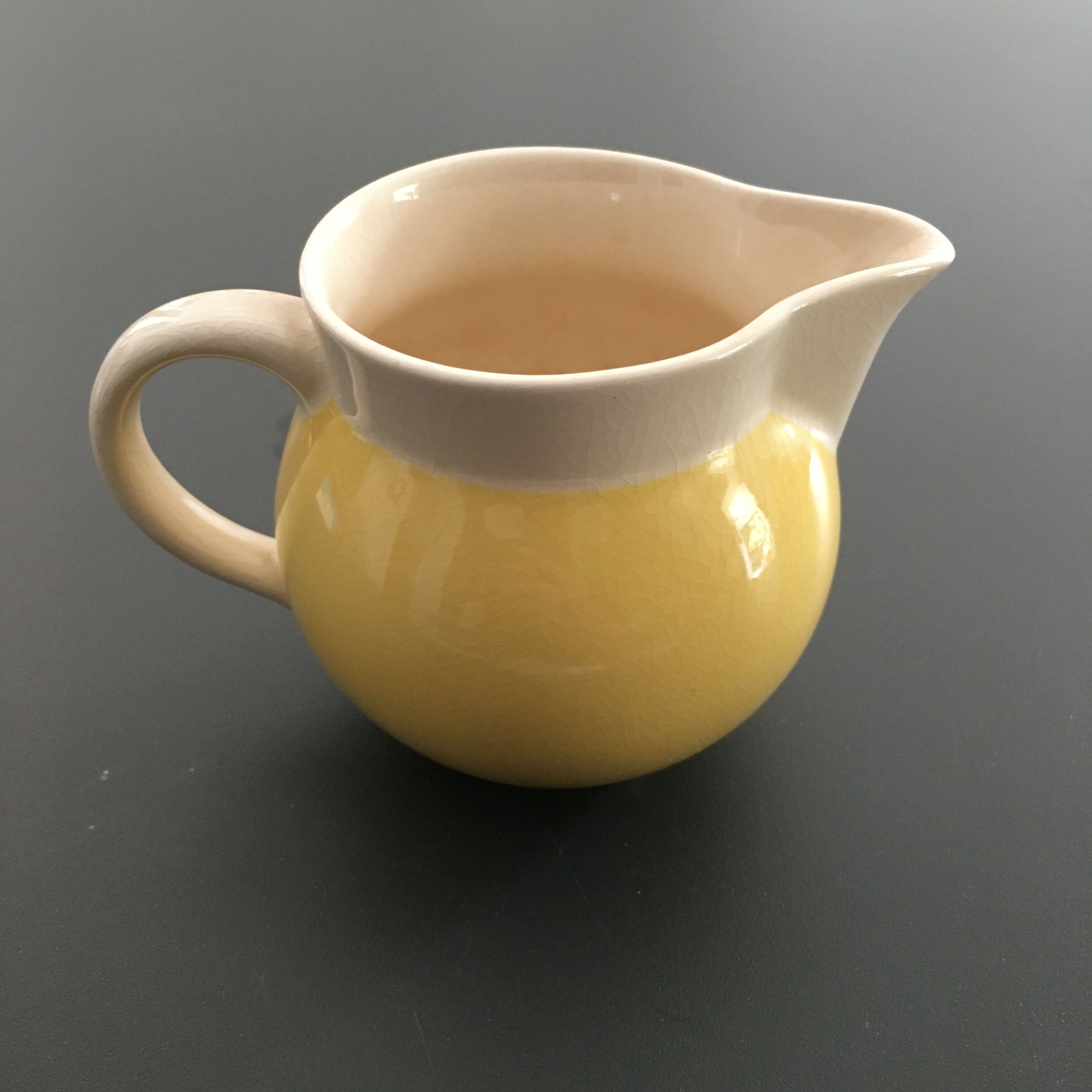 Yellow straw and ivory pitcher
