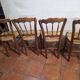 4 rustic farmhouse chairs made of wood and straw