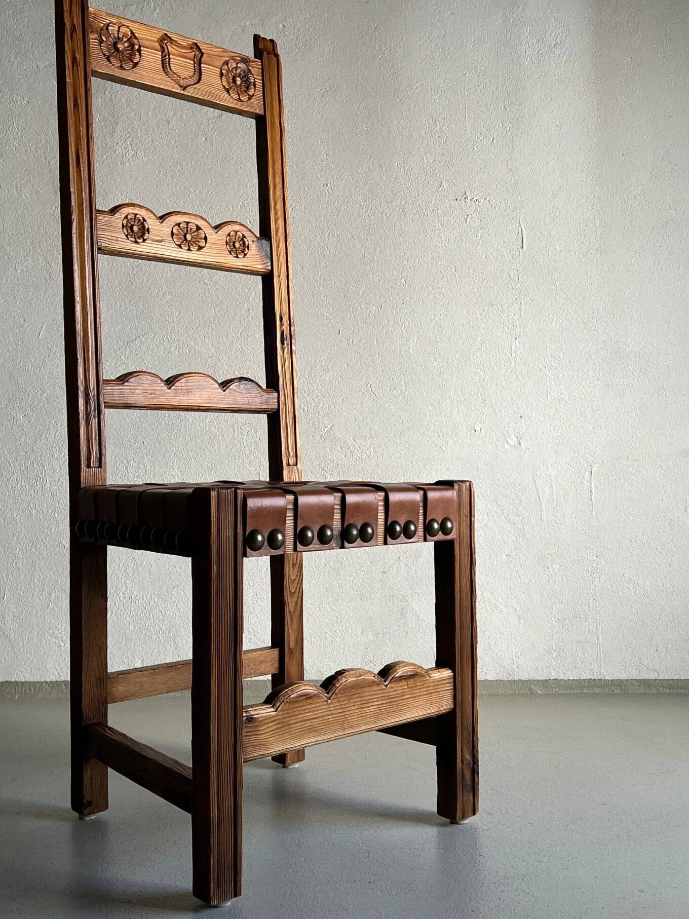 2 brutalist carved wood dining chairs with leather seat | The Netherlands | 1970s