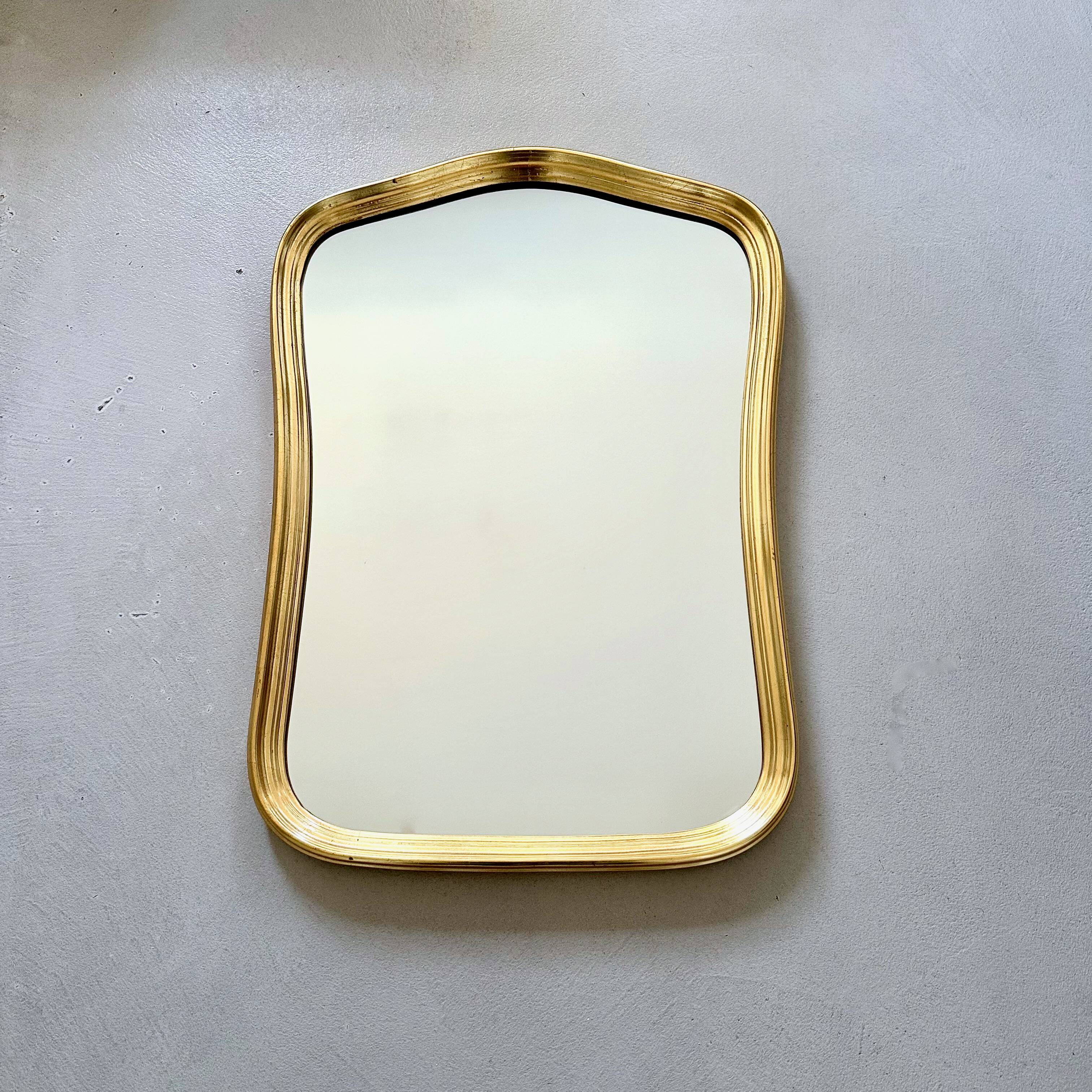 Vintage wall mirror with gold rim