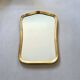Vintage wall mirror with gold rim