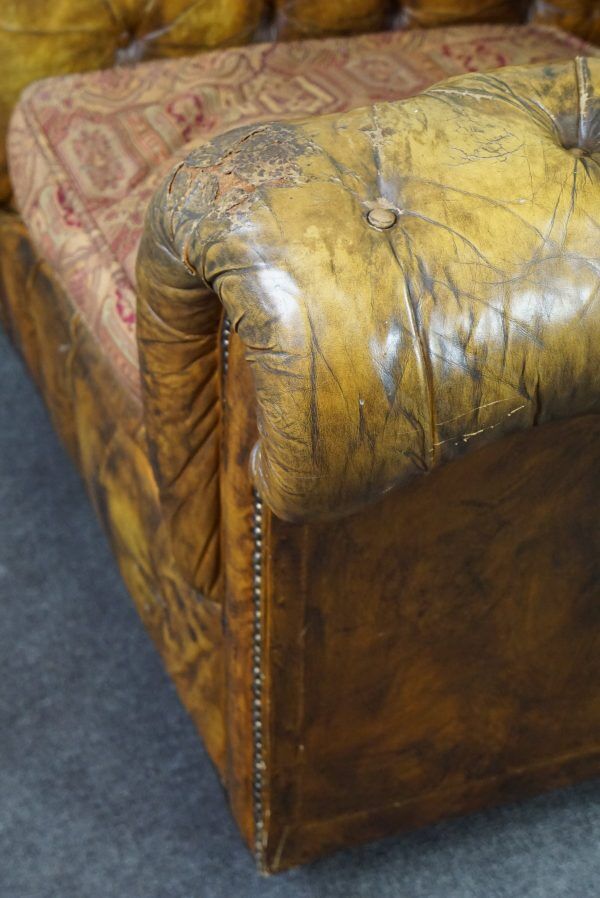 Patinated Chesterfield armchair