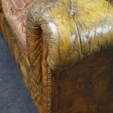 Patinated Chesterfield armchair