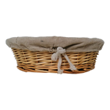 Braided rattan pan-maker bread basket covered with linen fabric