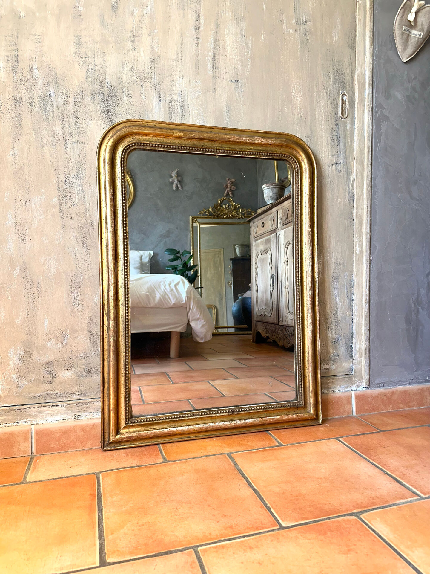 Antique Louis-Philippe gilded mirror from the 19th century.