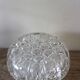 Large round glass flower frog vase with 19 holes.