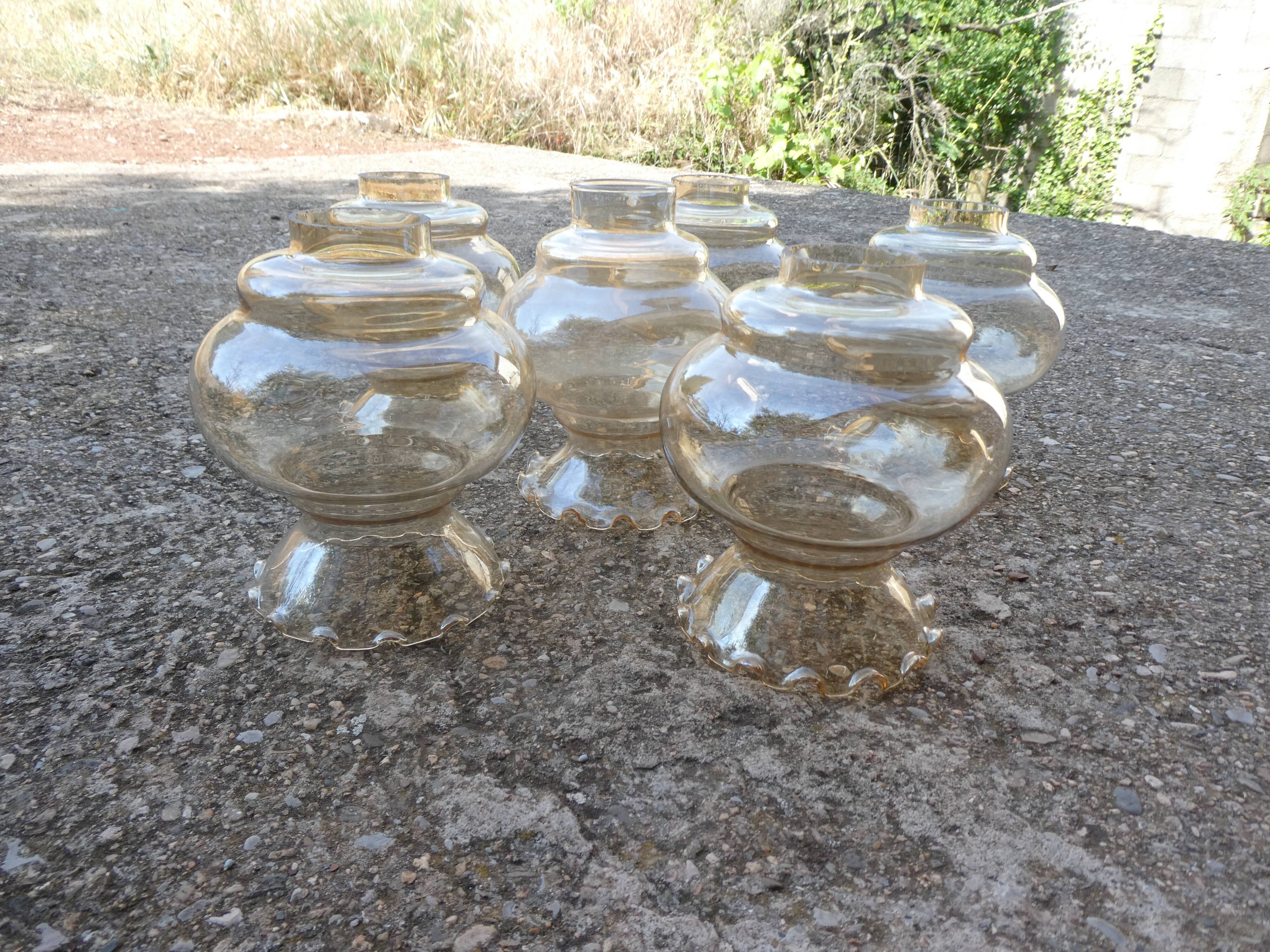 Set of 6 amber glass globes.