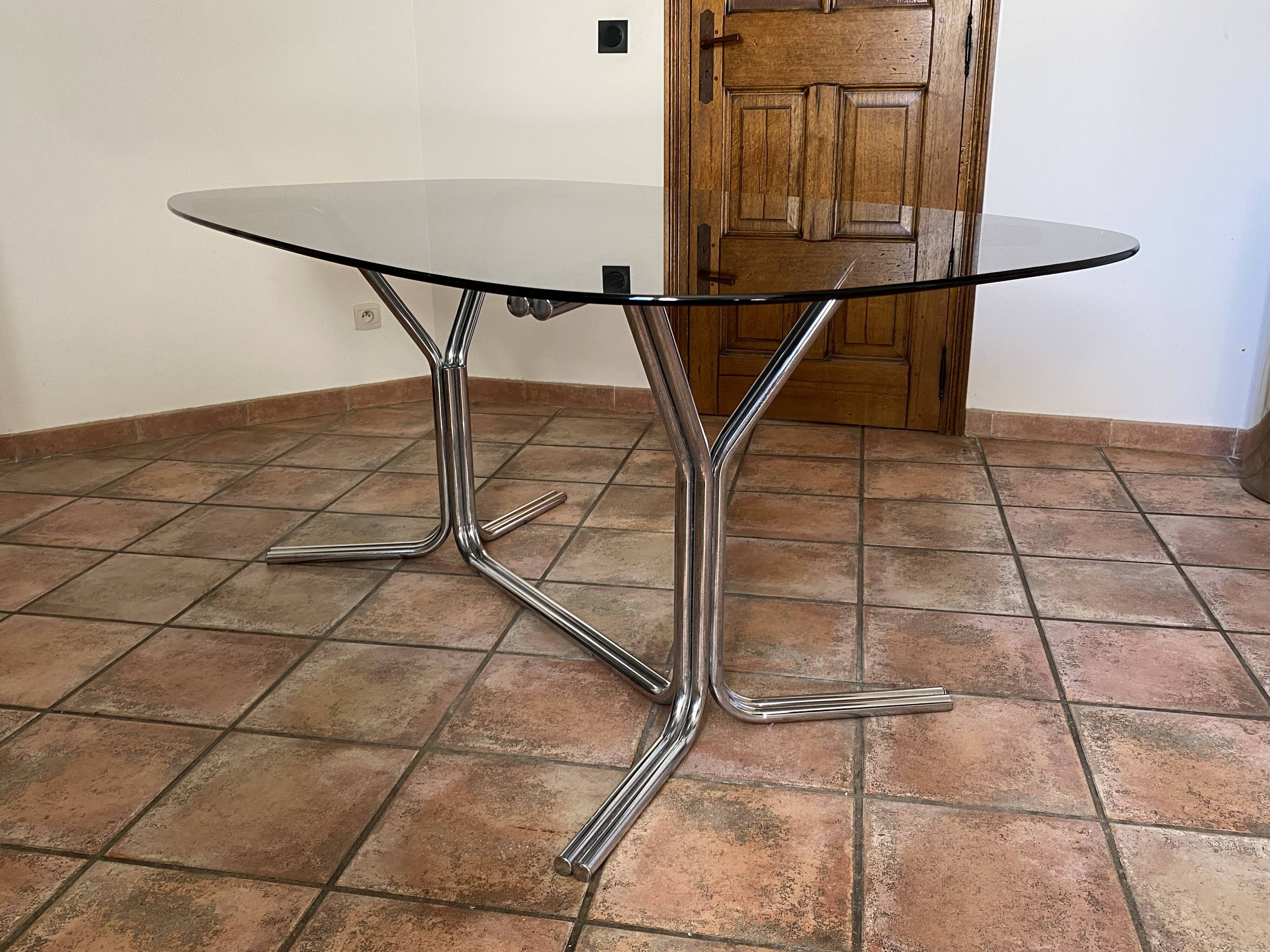 Oval table. 1970. Steel and smoked glass. 180x100