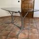 Oval table. 1970. Steel and smoked glass. 180x100