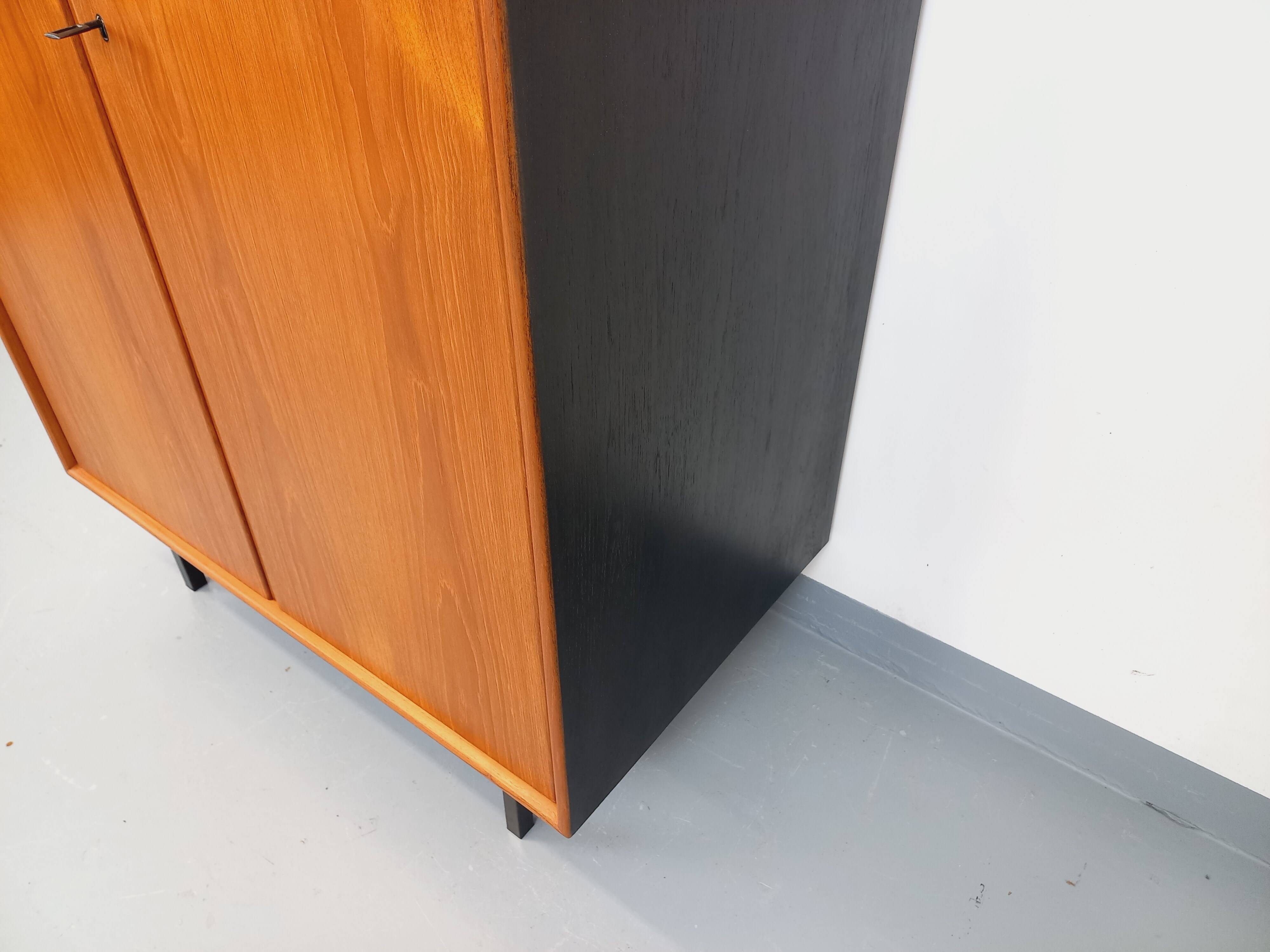 Vintage Scandinavian modernist wardrobe in teak and metal from the 1960s.