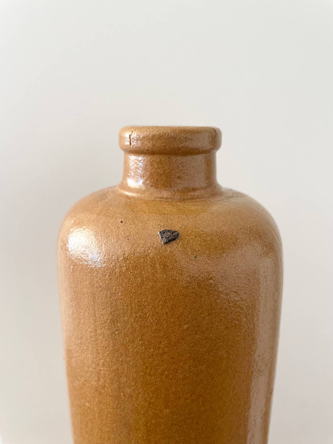 Old stoneware bottle with logo