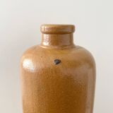 Old stoneware bottle with logo