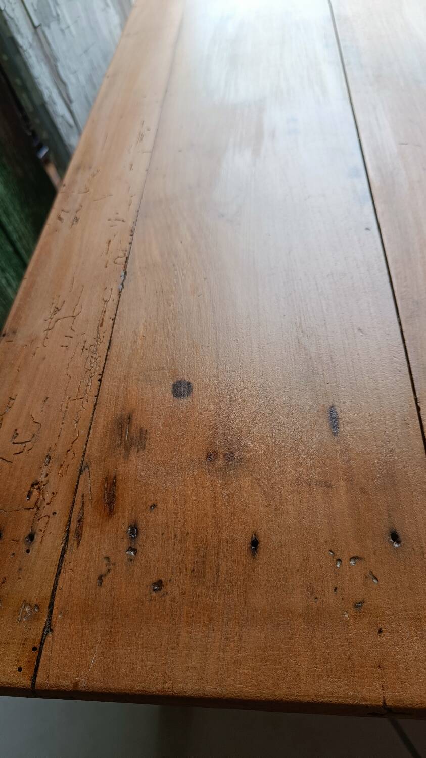 Coffee table with raw wood and a large drawer.