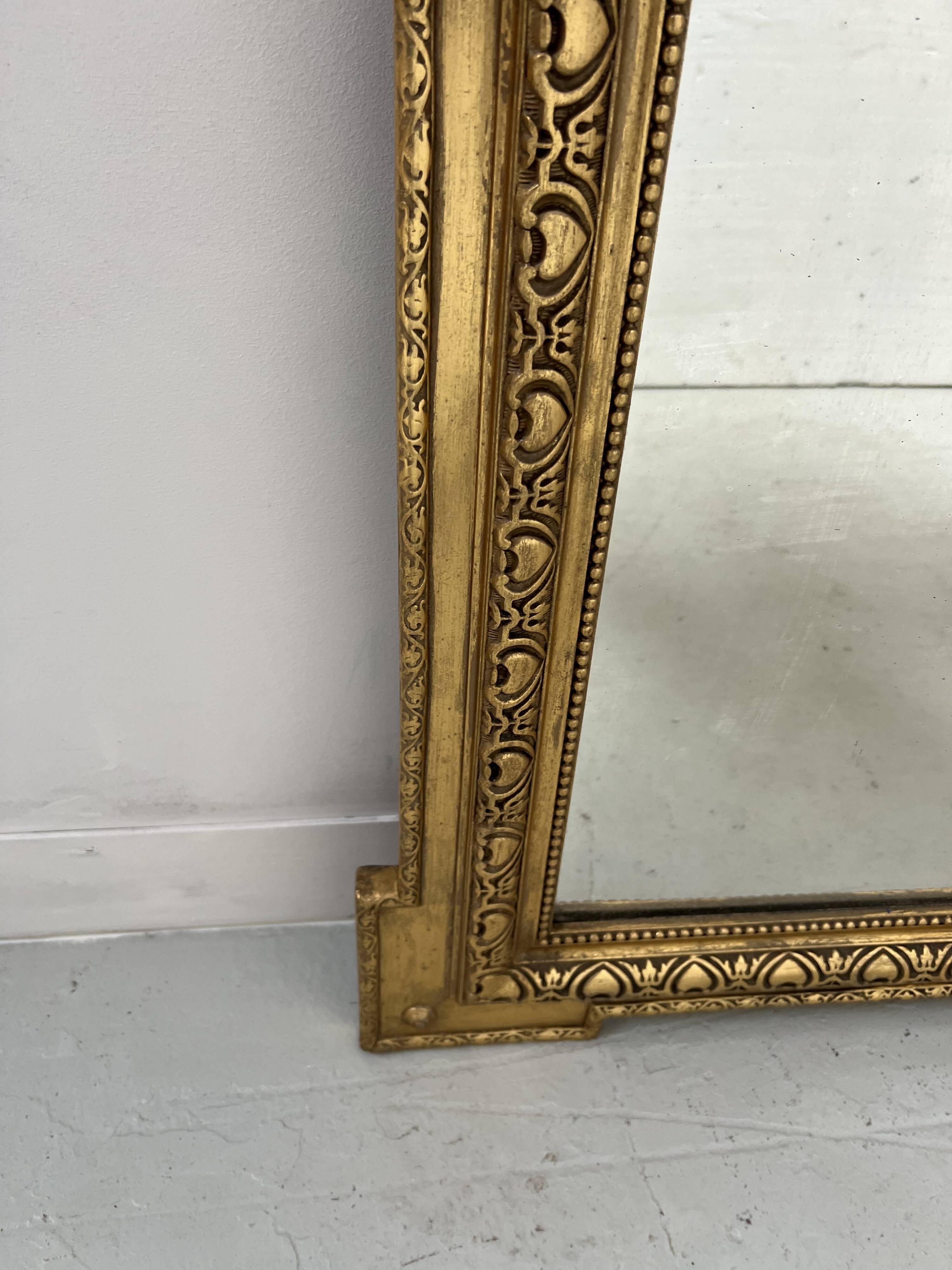 Louis XVI style mirror in wood and gilded stucco, 19th century