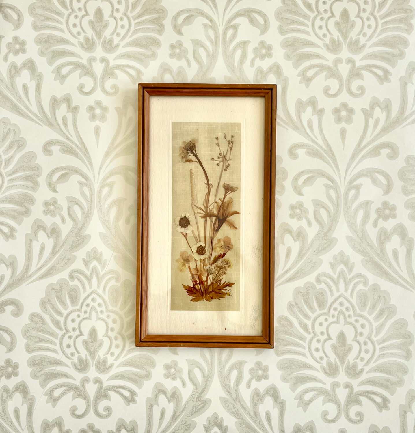 Vintage wood frame dried flowers under glass